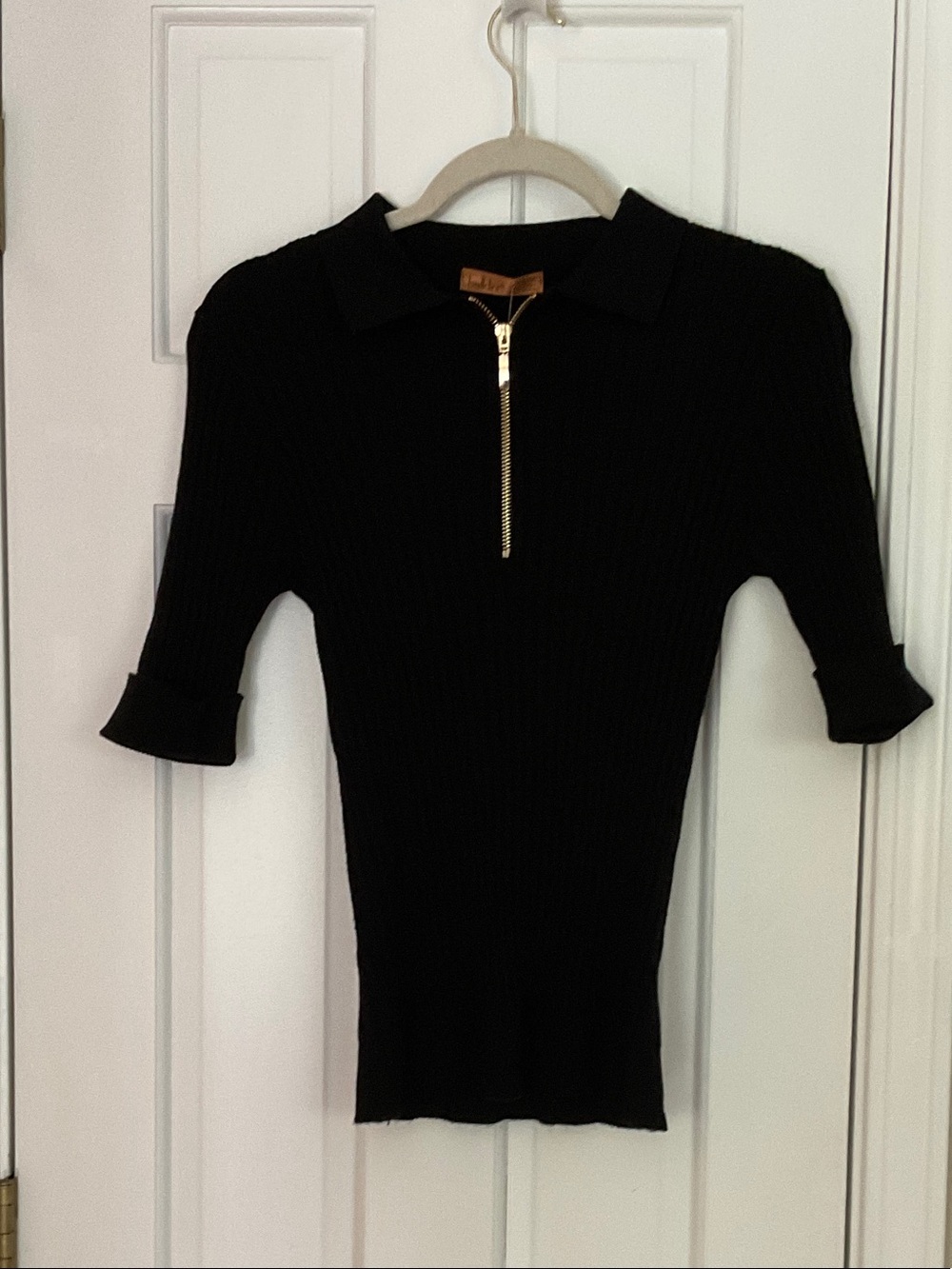 Bellini Black Ribbed Polo Top with Gold Zip